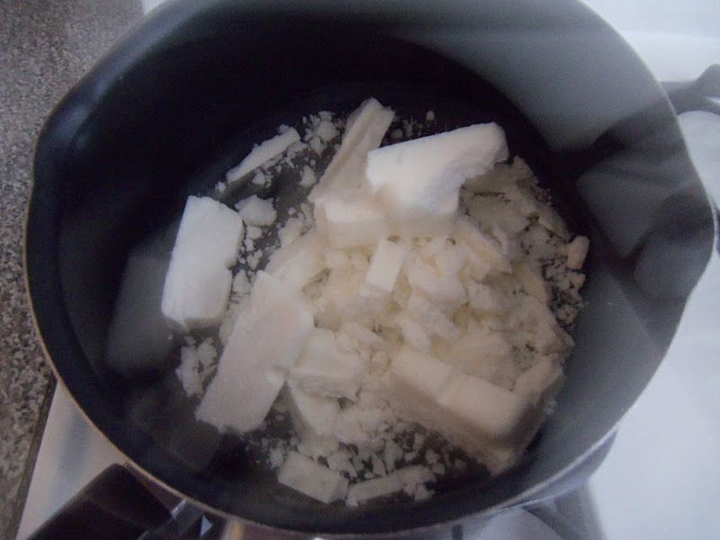Set up a double boiler by placing a small saucepan over a larger saucepan containing a couple of inches of water