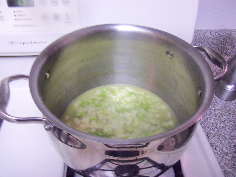 Melt 2 tablespoons of butter in a large pot over medium heat. Add the onion and celery and sauté until tender