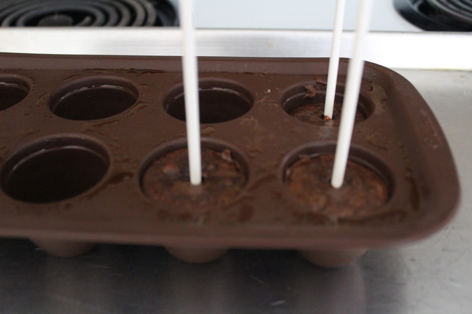 Pour the batter into the silicone brownie pops pan and follow the pan instructions for filling, inserting the sticks, and baking. Let the brownie pops cool completely.