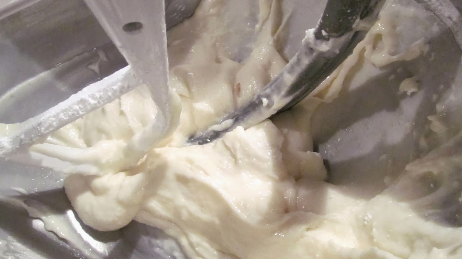 Beat cream cheese until smooth. Add powdered sugar and vanilla, then mix in milk until the frosting reaches a thick piping consistency