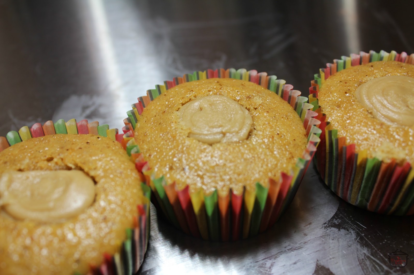 Pipe Penuche frosting into the center, level with the cupcake top