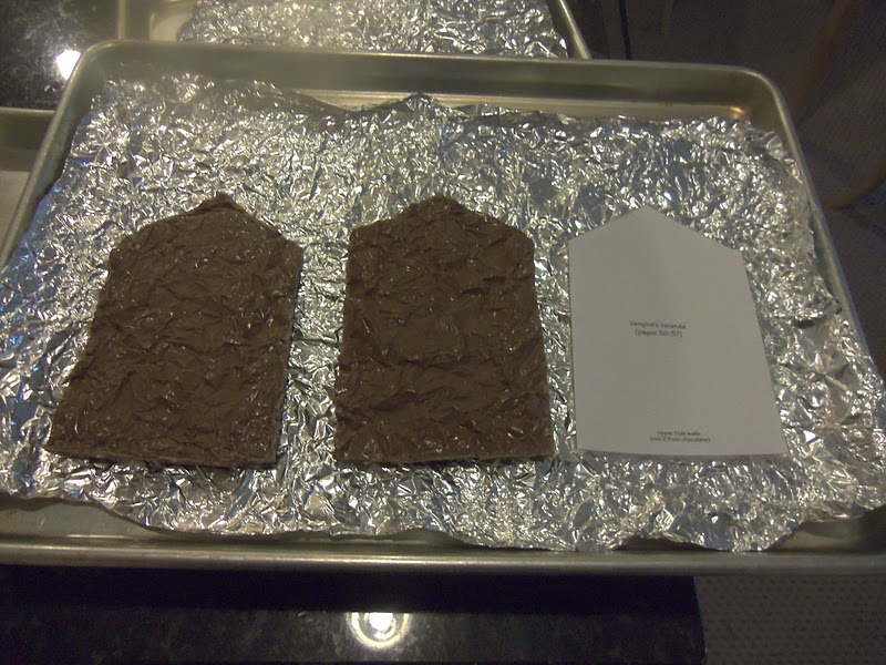The finished chocolate pieces should include 2 fronts, 2 bottom sides, and 2 top sides. Remelt leftover chocolate for additional pieces if needed.