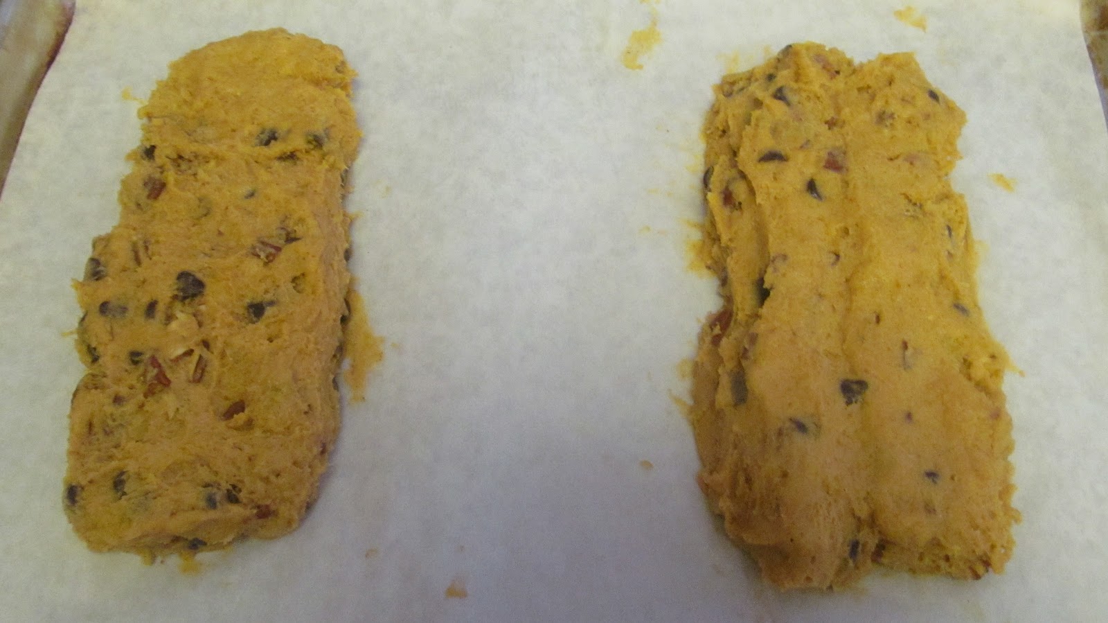 Divide dough in half and shape into two rectangles about 3 inches wide and 9–10 inches long on the prepared baking sheet