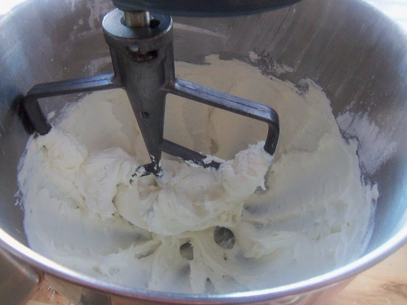 For the frosting, beat cream cheese until smooth and fluffy