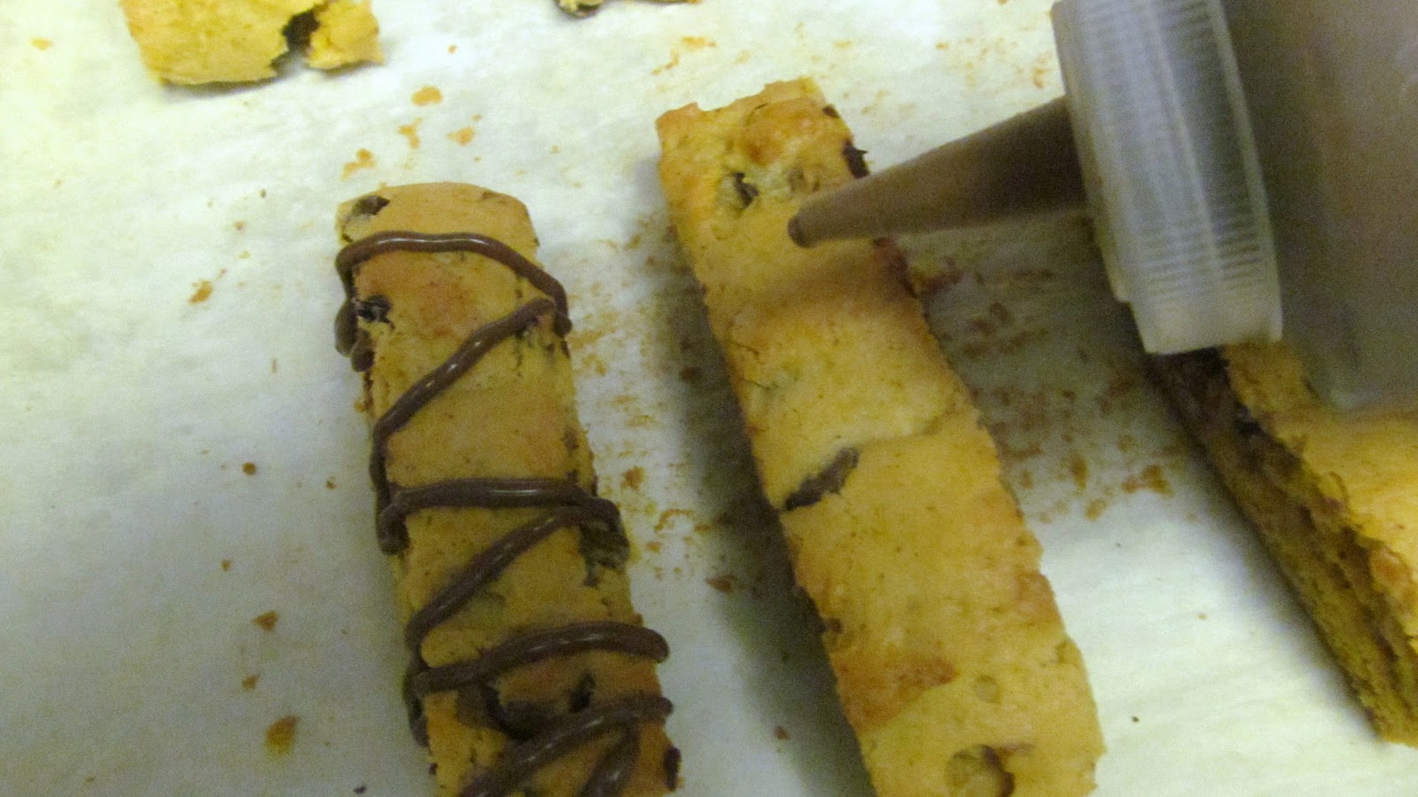 Melt the remaining chocolate and drizzle over the cooled biscotti
