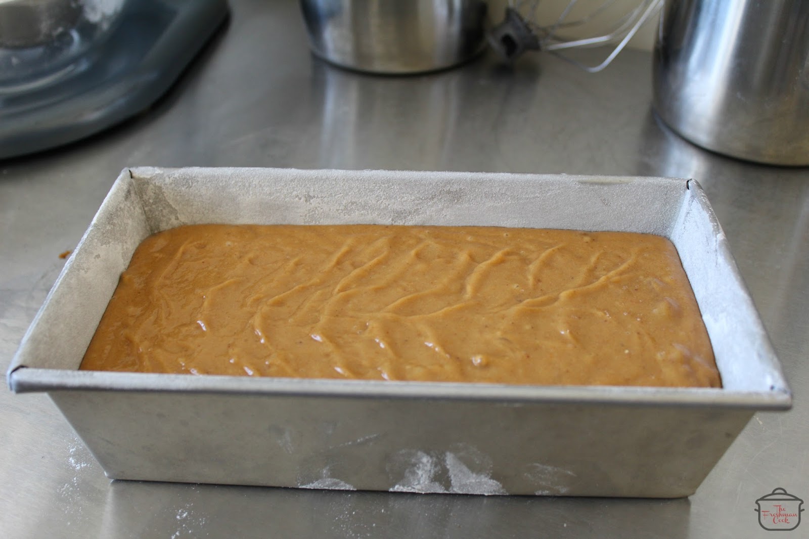 Pour batter into the prepared loaf pan and smooth the top