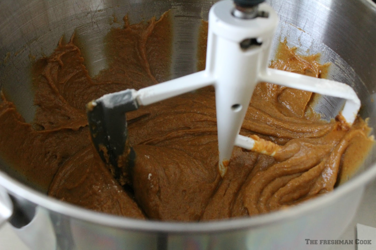 Add the pumpkin, egg yolks, dark brown sugar, vegetable oil, cloves, cinnamon, ginger, salt, baking powder, baking soda, vanilla, and flour to a large mixing bowl