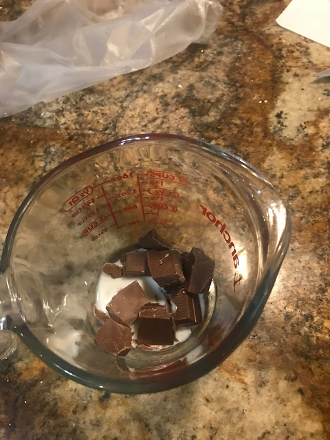 Melt chocolate chips with 1 tablespoon cream or milk in the microwave in 10–15 second intervals, stirring between each, until smooth and thin enough to drizzle