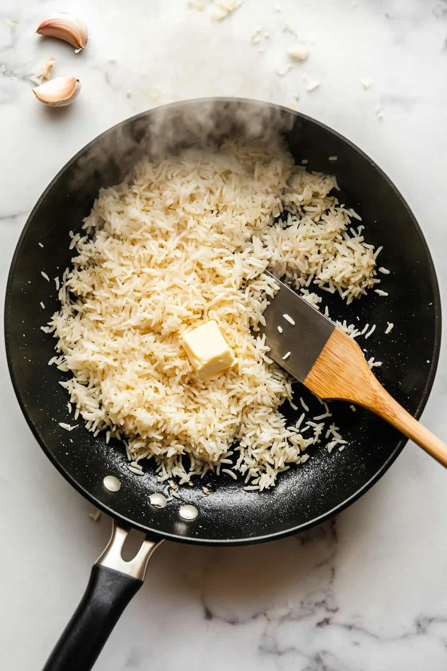 This image shows fried rice being prepared by sautéing garlic, adding cooked rice, soy sauce, and scrambled eggs, then tossing everything together with green onions for a delicious side dish.