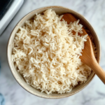 This image shows a bowl of fluffy and perfectly cooked Calrose rice, served and ready to be enjoyed, made easily in an Instant Pot.