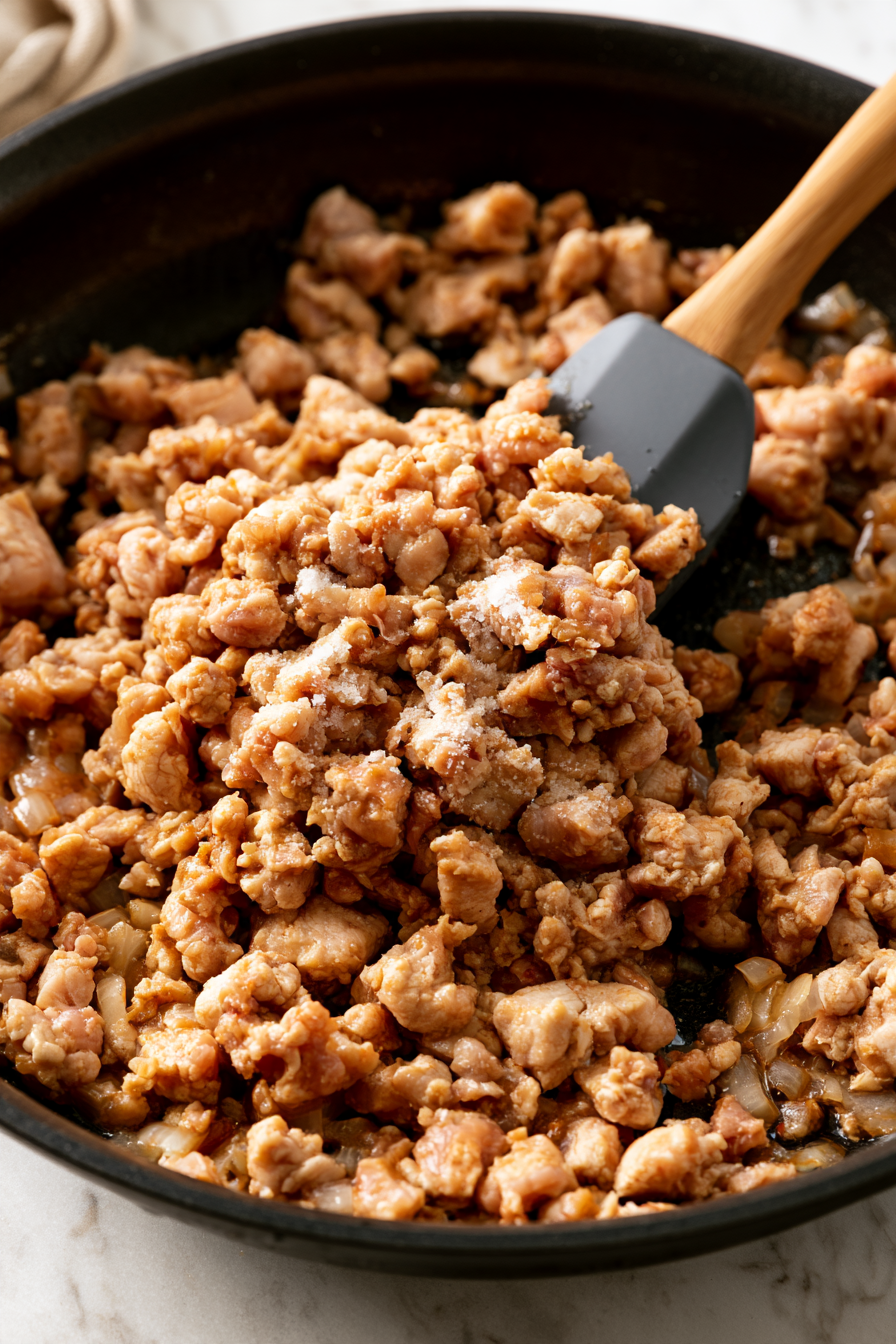 Next, add the ground turkey to the skillet, breaking it into bite-sized pieces with a spatula