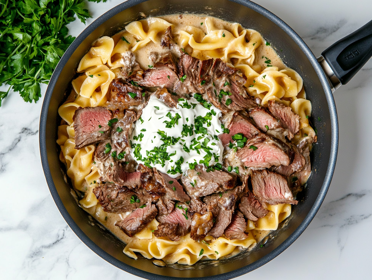 This image shows a bowl of rich and creamy leftover prime rib stroganoff, served over egg noodles and garnished with fresh parsley, creating a comforting and satisfying meal perfect for repurposing holiday leftovers.