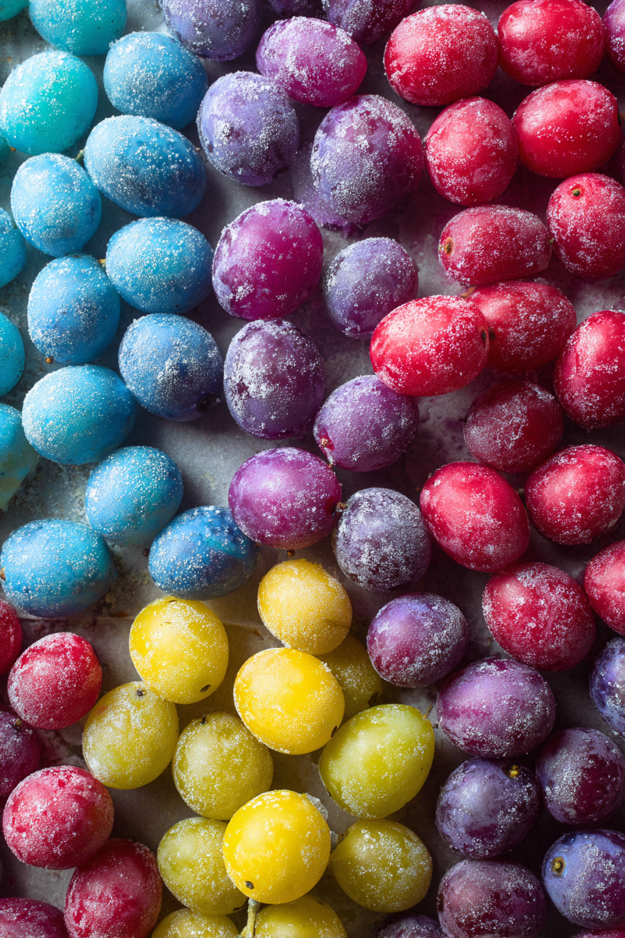 Spread the coated grapes onto a parchment-lined baking sheet in a single layer.