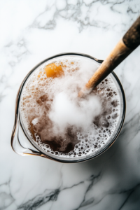 Stir with a long-handled spoon to prevent the dry ice from sticking to the sides and bottom of the pitcher. The dry ice will cause the root beer to bubble and create a fun fog effect.