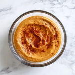 this image shows pumpkin cream dip in a glass bowl