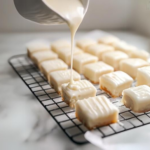 this image shows petits fours on a cooling rack