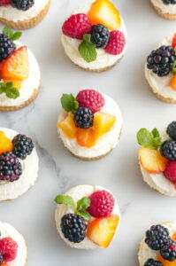 This image shows the cheesecake cups being covered and refrigerated for at least 4 hours, then served topped with fresh fruit.