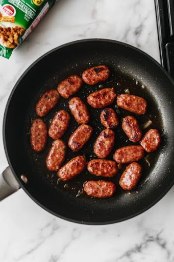 This image shows veggie sausage being cooked according to package instructions, then finely chopped and set aside