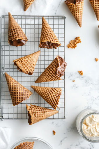 This image shows waffle cones being cooled.