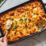 this image shows slicing Golden brown vegan breakfast casserole in the Baked Dish