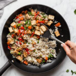 this image shows delicious vegan fried rice with tasty vegetables and soft rice.