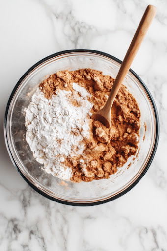 cinnamon, ginger, flour, and baking powder in a bowl