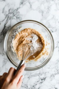 this image shows plant-based milk, almond butter, coconut sugar, and vanilla extract