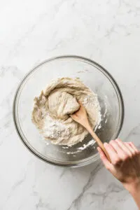 this is an image of flour, yeast, and salt in a large bowl