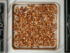 this image shows golden brown Mashuga nuts in a baking tray