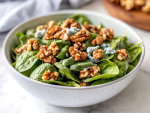 This image shows the completed salad, garnished with walnuts, ready to be served.