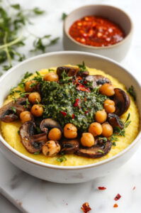 This image shows a small bowl of extra chimichurri sauce placed beside the dish, ready for dipping or adding more flavor.