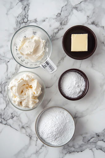 this image shows Butter, cream cheese, sugar salt in seperate bowls