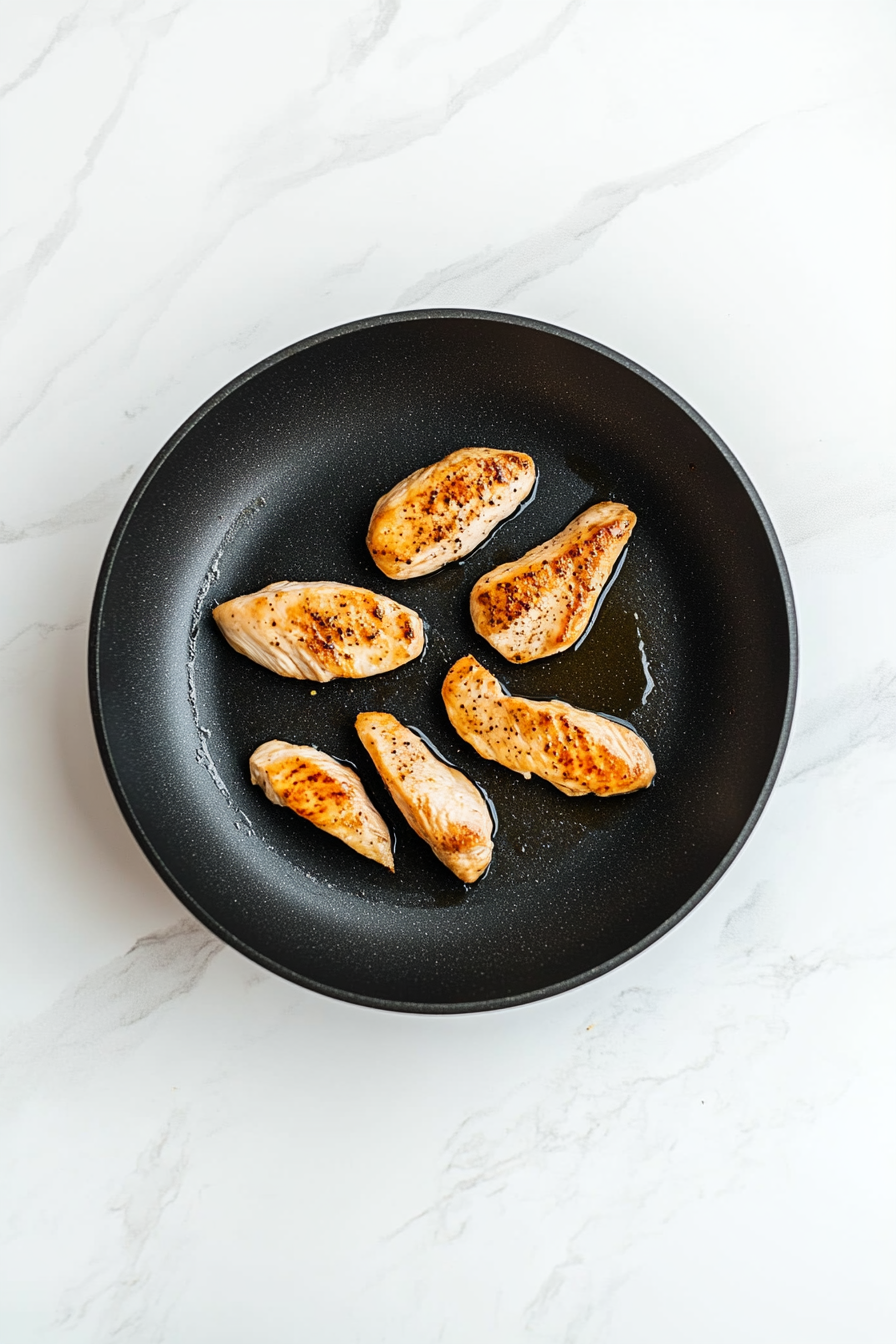 (Optional) Sear chicken in a skillet with oil for 1-2 minutes per side for added flavor.