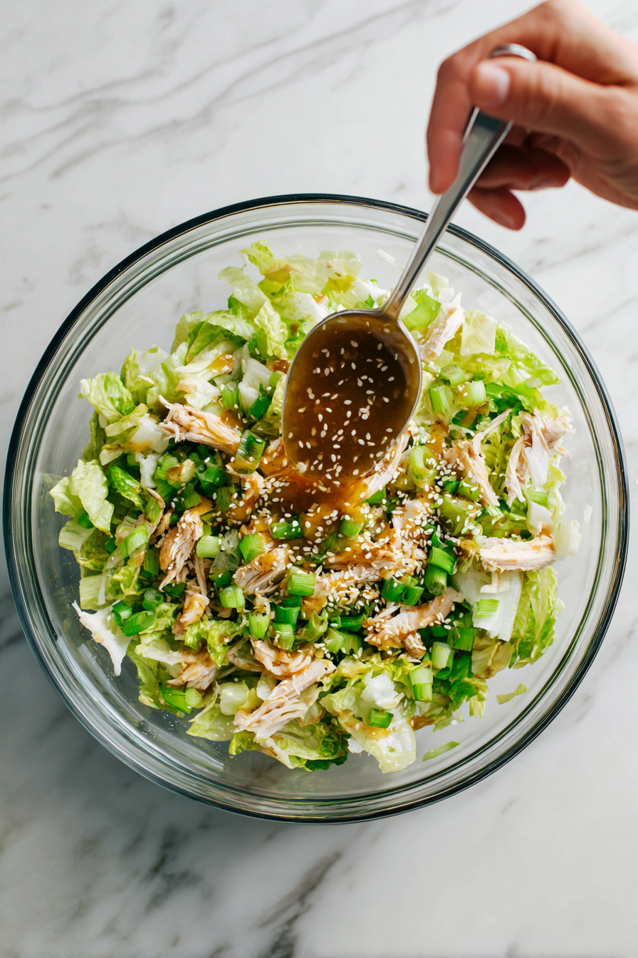 Pour the dressing over the salad and toss everything gently.