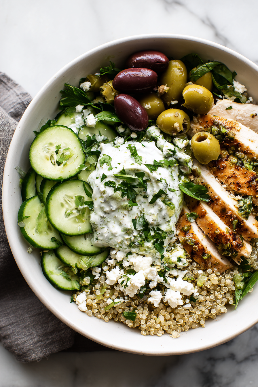 Finish with crumbled feta and smashed olives for added flavor and texture.