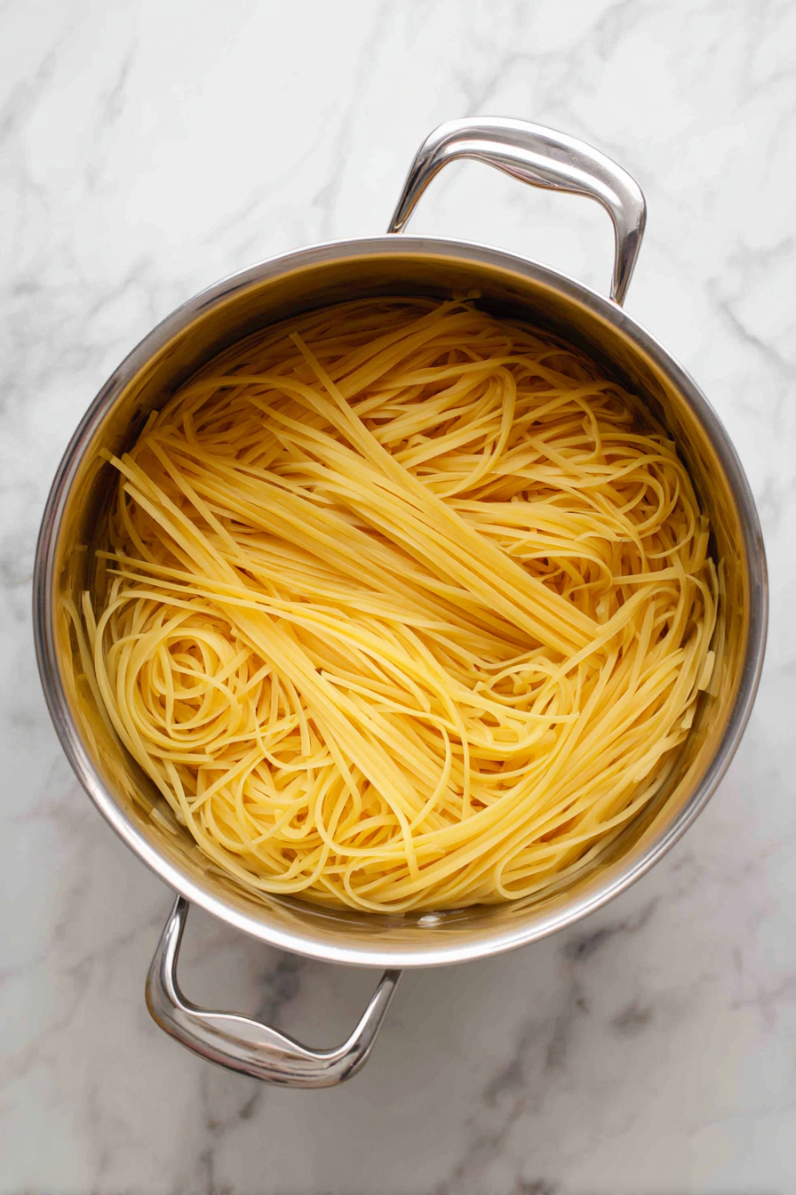 Cook pasta until al dente, drain, and set aside.