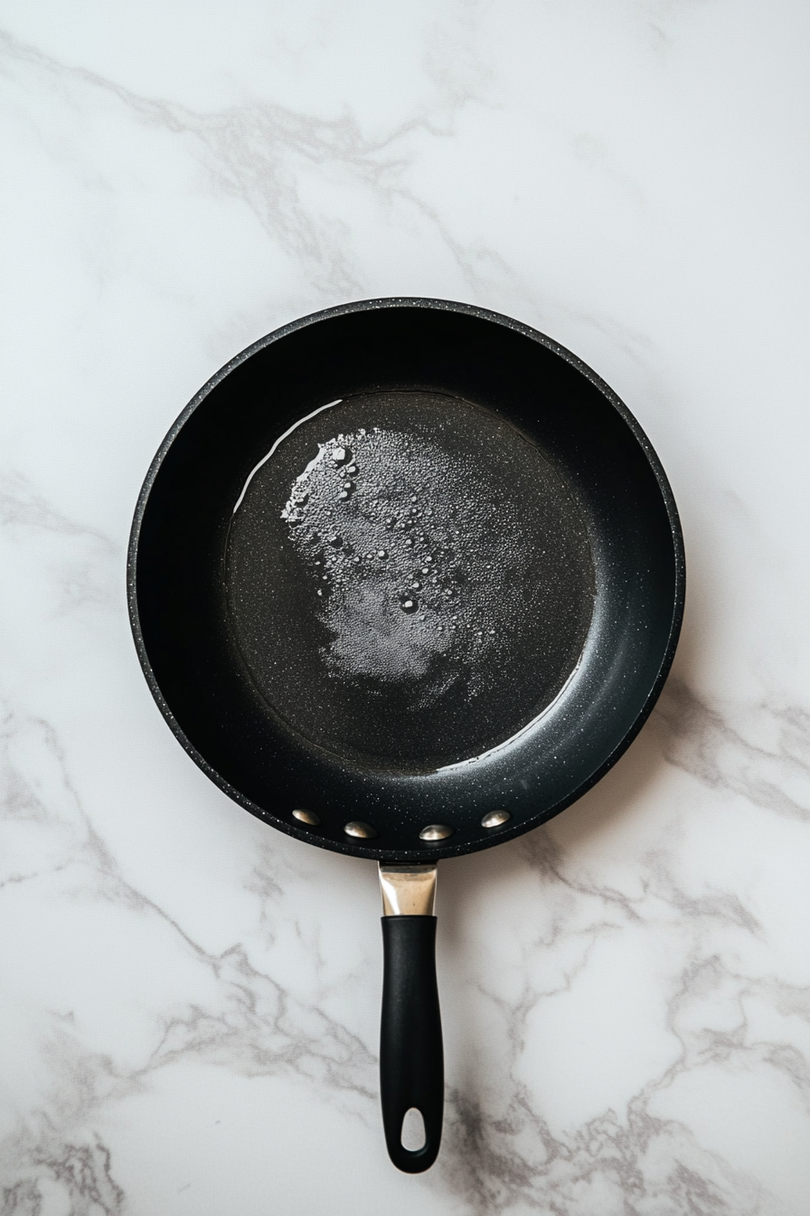 Heat oil in a frying pan over medium heat until hot but not smoking.