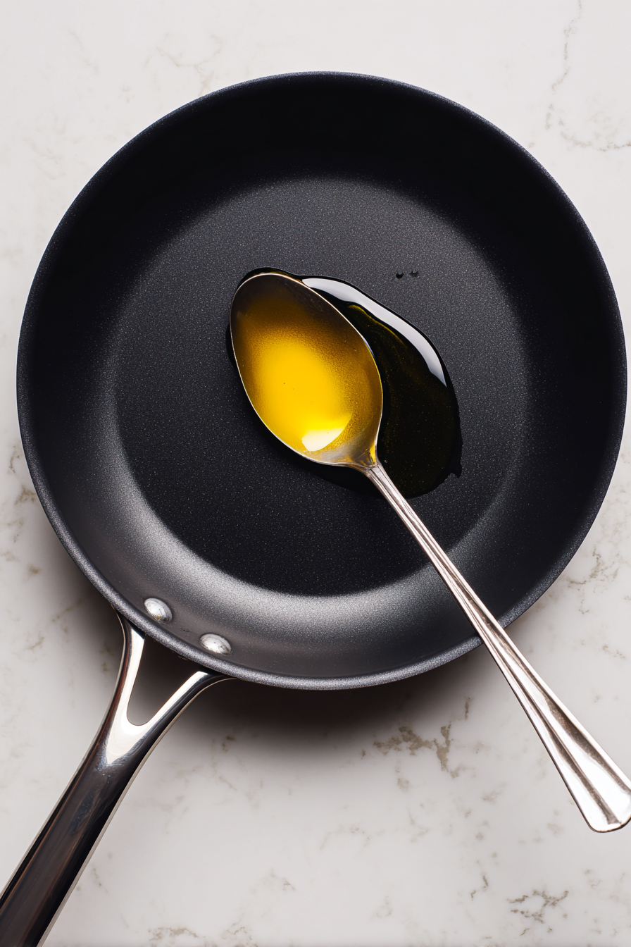 Heat vegetable oil in a skillet over medium heat.