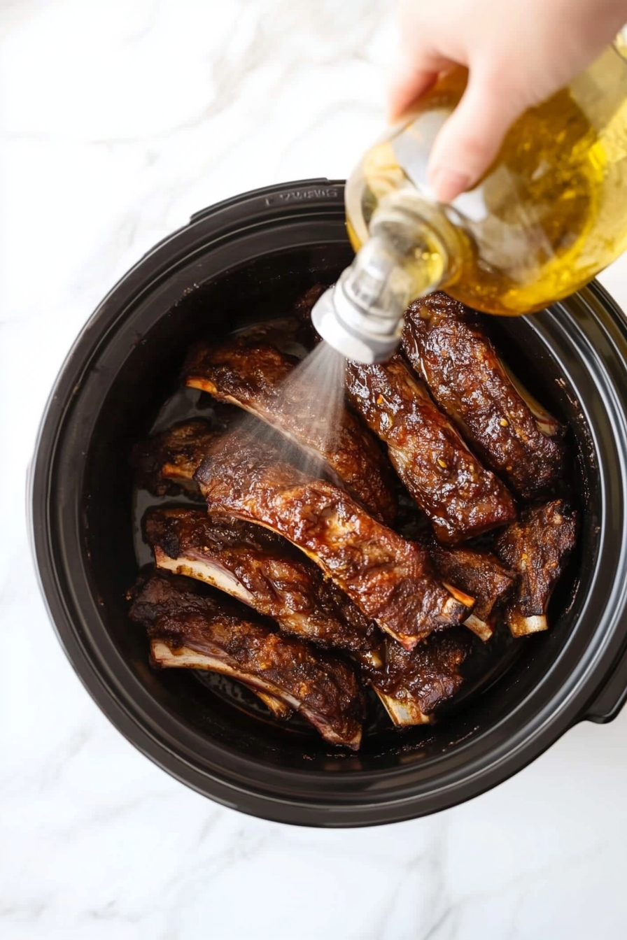 (Optional) Lightly spray olive oil on the ribs for extra moisture.