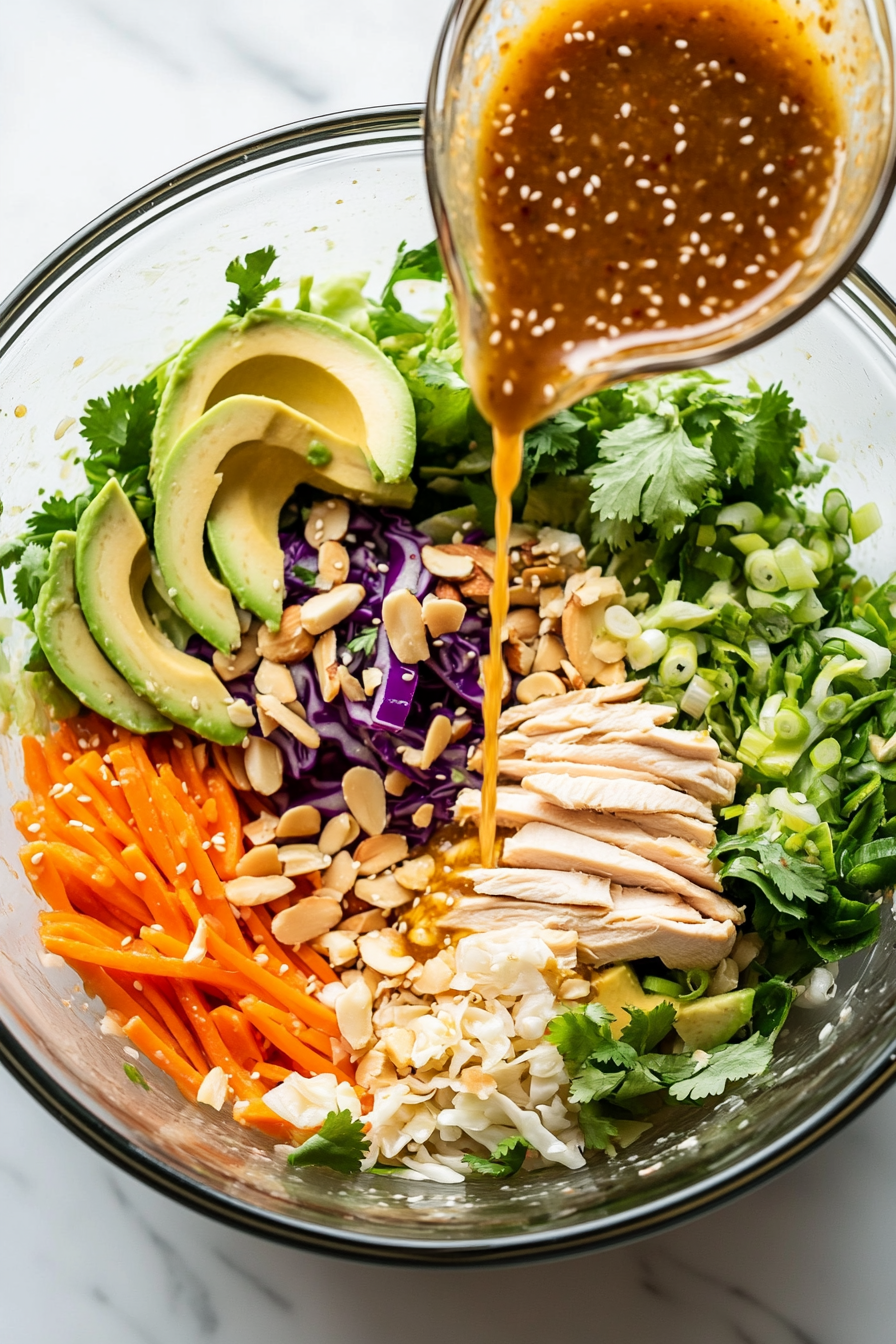 Pour the dressing over the salad ingredients.