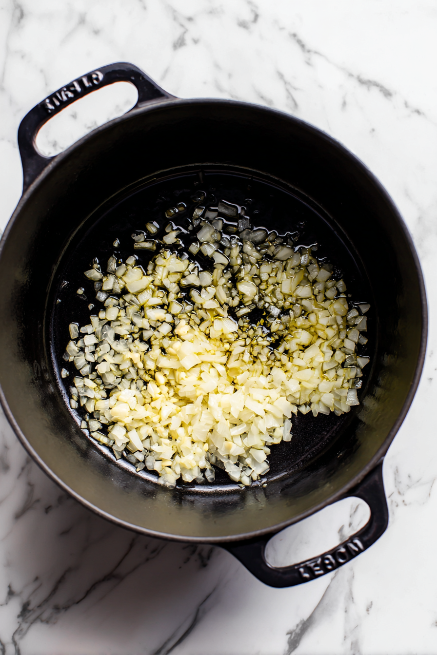 Add chopped onion and garlic; sauté until softened.