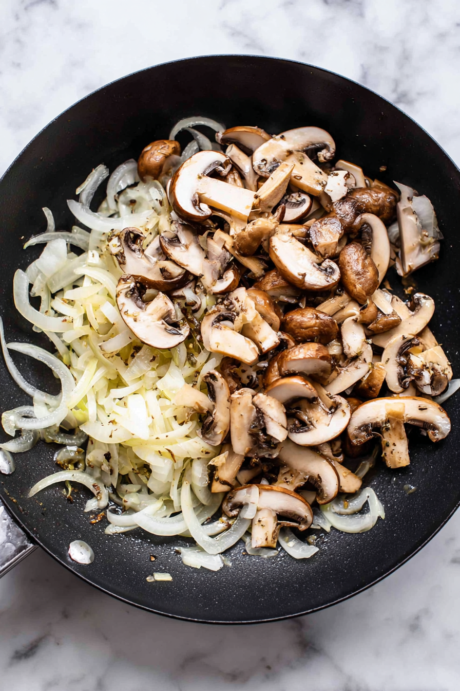Sauté onions until soft, then add mushrooms and cook until browned.