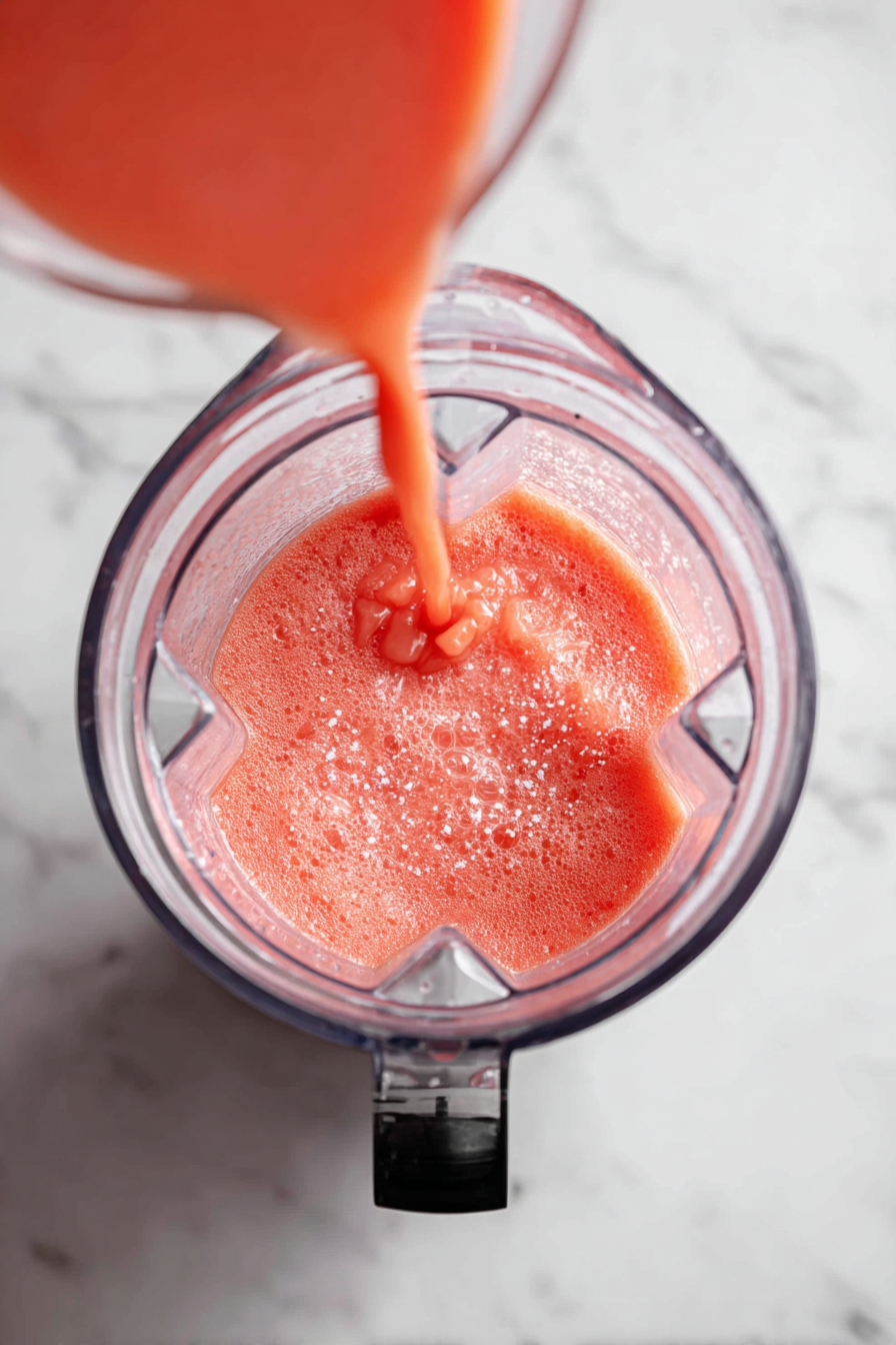 Add orange juice and sugar to the blender; blend again.