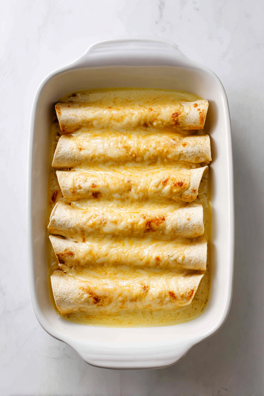 Pour sauce over enchiladas and top with extra cheese.