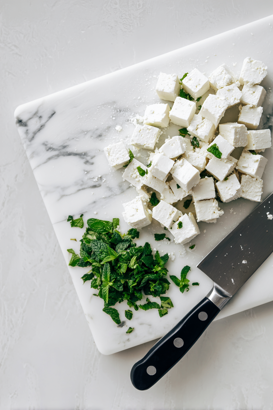 Cube the feta cheese and finely mince the fresh mint.
