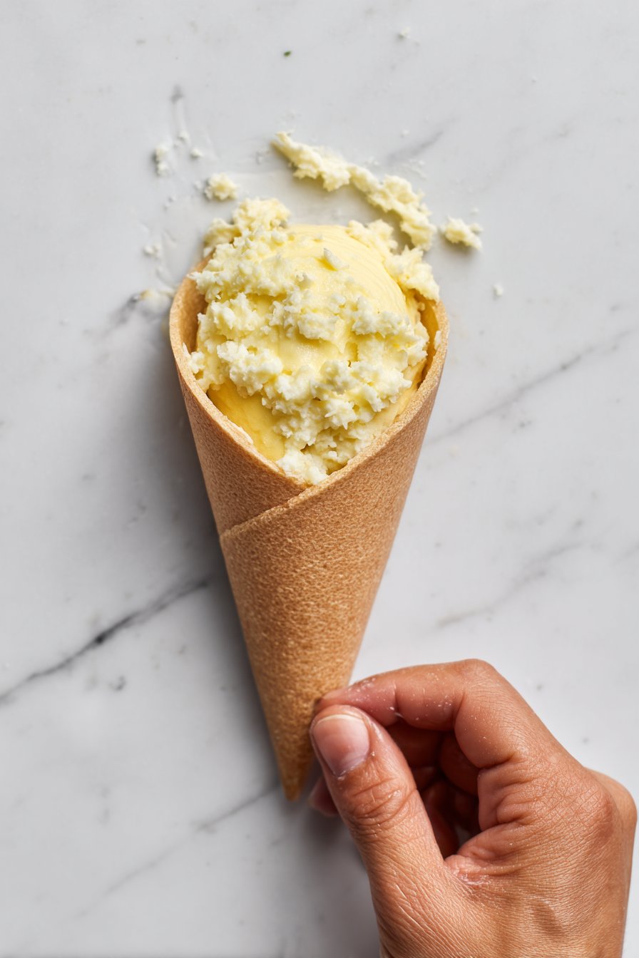 Fill each cone with the potato mixture and seal with water.