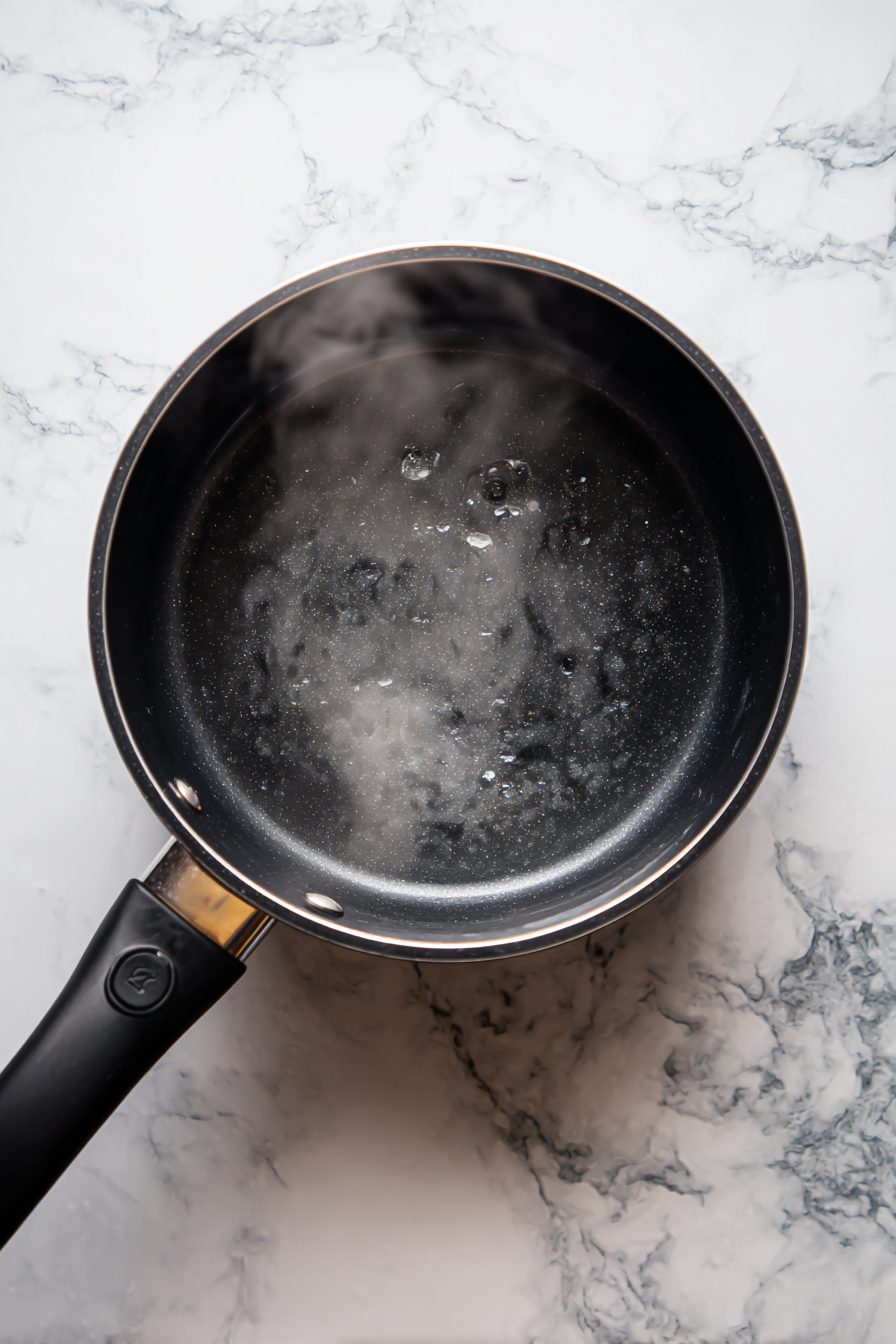 Cook over medium heat, stirring constantly, until mixture thickens and becomes glossy.