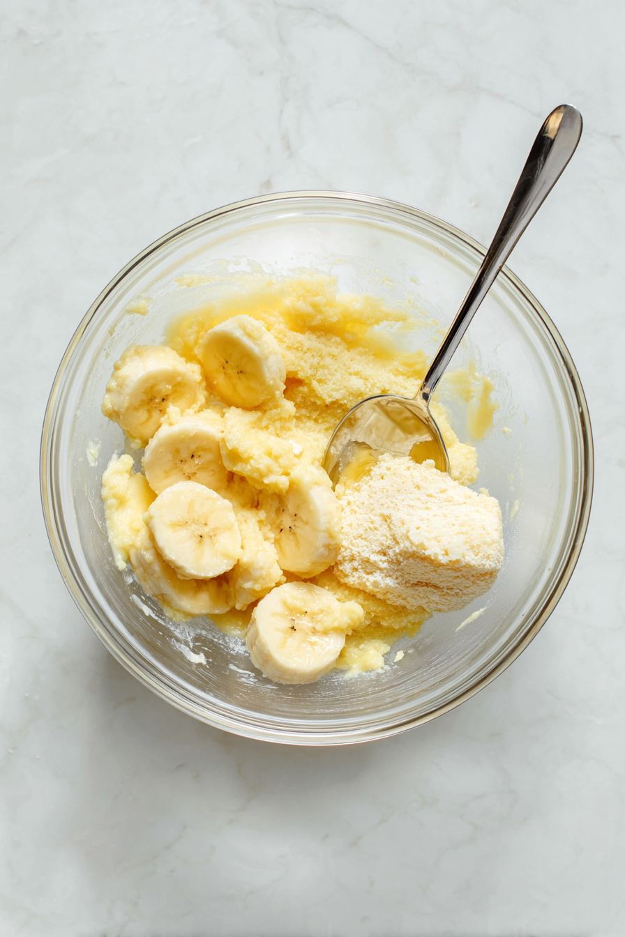 Add softened butter, sugar or maple syrup, egg, and vanilla; mix well.